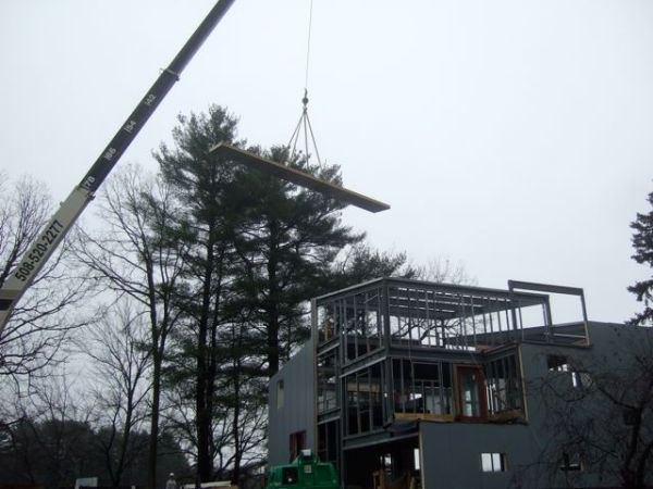 Crane Lifts Roof Panel Up